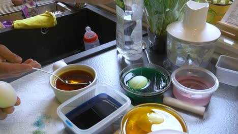 Easter-Egg-Painting-Table-With-People's-Hands-Visible