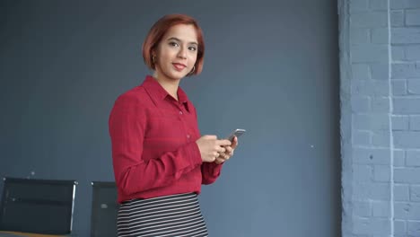 Asian-Businesswoman-with-Smartphone