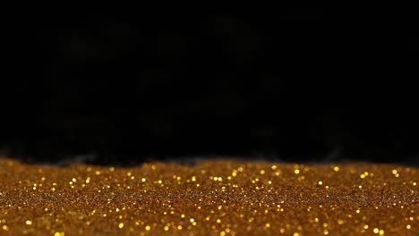 Coin-of-1-Euro-Rolling-on-Gold-Powder-against-Black-Background,-Slow-motion-4K