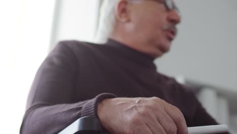 Mature-Professor-Sitting-in-Wheelchair-and-Talking