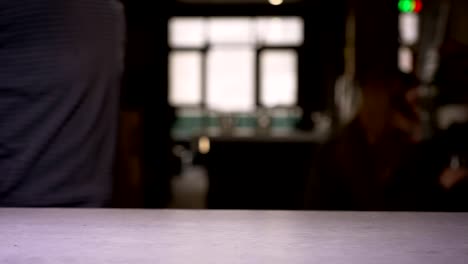 Close-up-shot-of-woman-attaches-smartphone-to-terminal-performing-successful-contactless-payment.