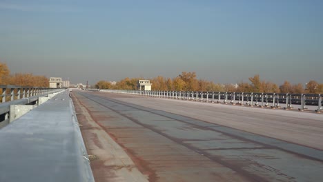 Unfinished-bridge-against-the-background-of-the-silhouette-of-the-city.-Unfinished-highway-away-city