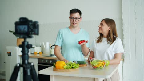 Happy-family-recording-video-about-organic-vegetables-talking-using-camera