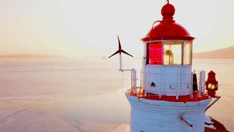 Aerial-winter-view-of-the-Tokarevskiy-lighthouse---one-of-the-oldest-lighthouses-in-the-Far-East,-still-an-important-navigational-structure-and-popular-attractions-of-Vladivostok-city,-Russia.