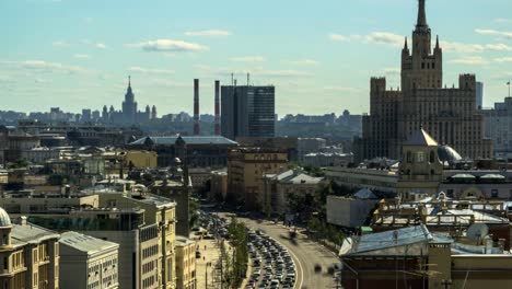 top-view-of-the-rooftops-and-the-traffic-on-the-city-streets