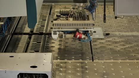 Robot-arm-in-a-metal-factory-picks-up-metal-plates