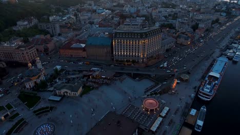 Square-near-the-river-station-in-the-old-town-at-sunset-aerial