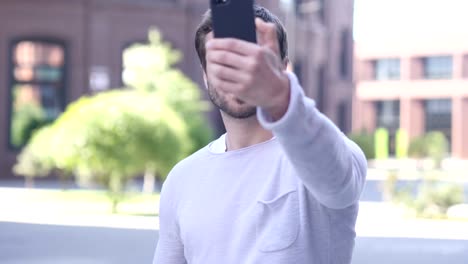 Portrait-of-Handsome-Man-Taking-Selfie-on-Phone