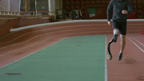 Runner-with-Prosthetic-Limb-Warming-Up-on-Track