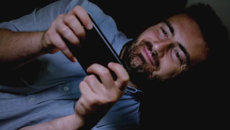 One-happy-man-using-smartphone-at-night