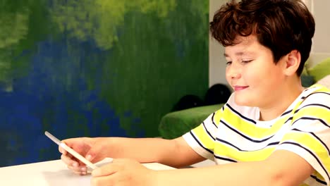 Portrait-of-a-teen-with-digital-tablet-computer-at-home