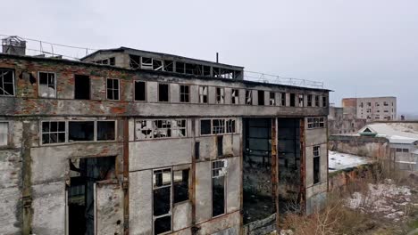 Old-abandoned-plant-with-broken-windows-ruined-after-the-military-actions.