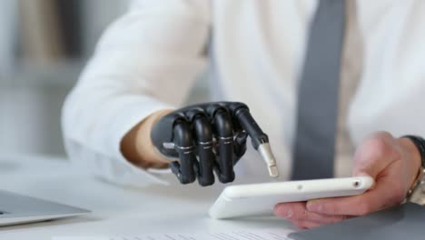 Unrecognizable-Businessman-with-Prosthetic-Hand-Working-on-Tablet