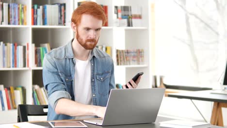 Multitasking,-Casual-Redhead-Man-Using-Phone,-Tablet-and-Laptop