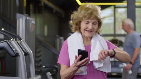 Old-Woman-Using-Devices-in-Gym