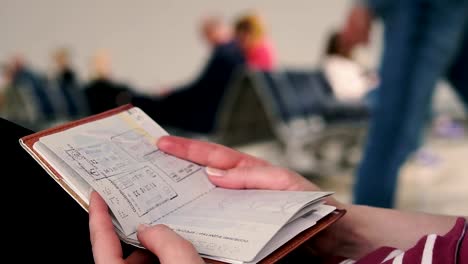 Passport.-The-girl-turns-over-the-passport-at-the-airport