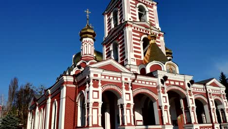 Upward-view-of-the-high-domed-Christian-church-in-motion-on-a-sunny-day.