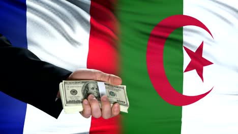 France-and-Algeria-officials-exchanging-tank-for-money,-flag-background,-weapon