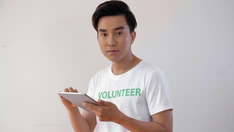 Male-Volunteer-with-Tablet