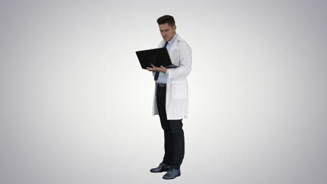 Doctor-showing-results-in-laptop-on-gradient-background