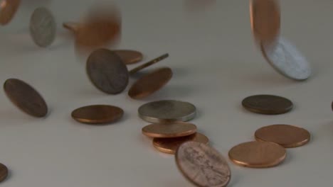 Extreme-slow-motion-in-300-FPS-of-coins-flipping-on-a-table