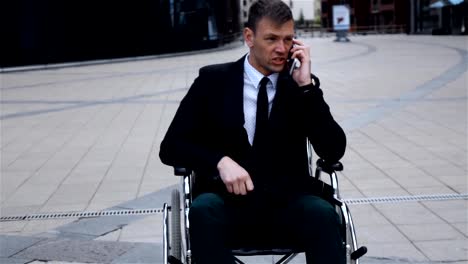 Disabled-Invalid-businessman-talking-by-phone