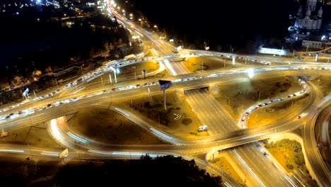 Hyperlapse-timelapse-of-night-city-traffic.-vertical-aerial-view.