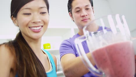 Healthy-lifestyle-Ethnic-couple-making-organic-fruit-smoothie