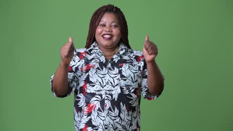 Overweight-beautiful-African-woman-against-green-background