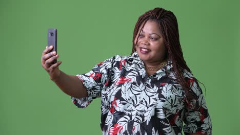 Overweight-beautiful-African-woman-against-green-background