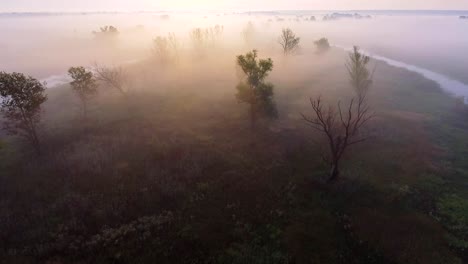 Aerial-footage-video-of-foggy-morning.-Flying-over-the-Desna-river.-Sunrise-time.-Kyiv-region,-Ukraine.