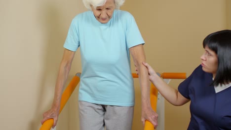 Physiotherapist-Helping-Elderly-Patient-Gait-Training-on-Stairs