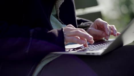 Close-up-shot-of-female-hands-typing-on-keyboard-of-laptop.