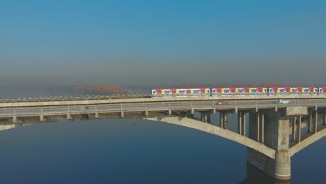 Subway-train-ride-over-bridge-crossing-river