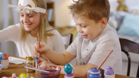 Adorable-Siblings-Coloring-Easter-Eggs