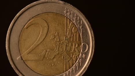 One--Euro-Coin-footage-on-a-black-background.