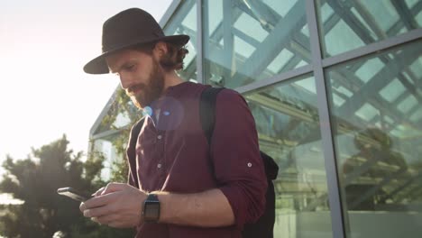 Young-Trendy-Man-Using-Smartphone