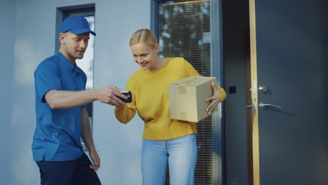 Beautiful-Young-Woman-Opens-Doors-of-Her-House-and-Meets-Delivery-Man-who-Gives-Her-Cardboard-Box-Package,-She-Signs-Electronic-Signature-POD-Device.