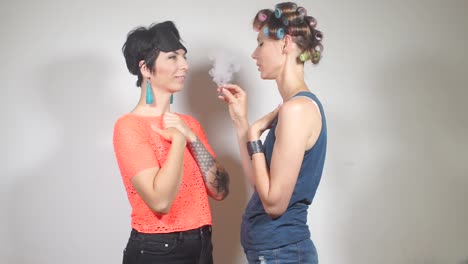 girl-smokes-a-cigarette-with-medical-marijuana-next-to-her-friend