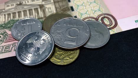 Russian-Rubles-Banknotes-and-Coins-Turning-on-Black---RUB