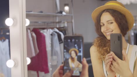 Young-Good-looking-Woman-Making-Photos-in-Mirror