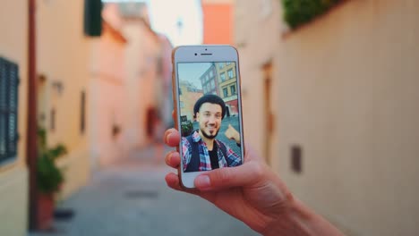 Close-up-of-man-speaking-on-video-call-on-smartphone