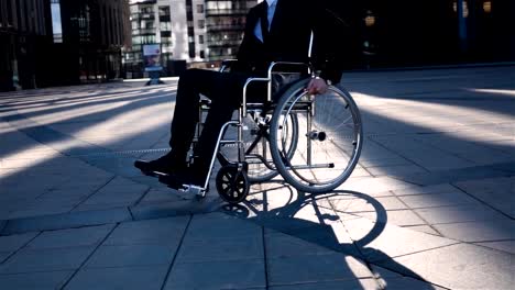 Physically-disabled-businessman.-He-turning-his-wheelchair-to-camera-front