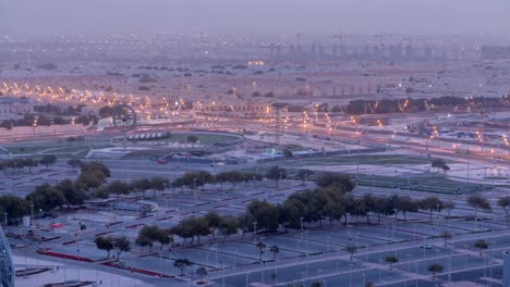 Aerial-view-of-Aspire-Zone-from-top-night-to-day-timelapse-in-Doha