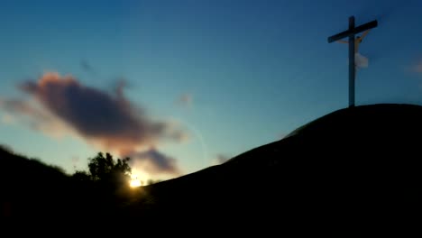 Christian-woman-praying-at-Jesus-cross,-sunset