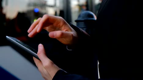 Close-up-on-the-hand-of-young-woman-using-tablet---technology,-social-network,-communication-concept