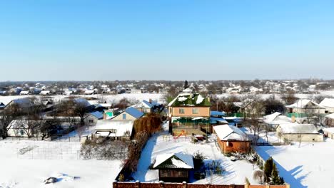 CHERKASY-REGION,-UKRAINE,-DECEMBER-25,-2018:-winter,-snow-covered-streets,-houses.-frosty-sunny-day.-aero,-view-from-above