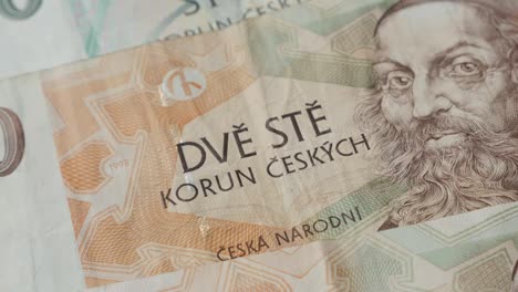 Slow-tilt-on-national-Czech-Republic-koruna-currency-4K-2160p-30fps-UltraHD-footage---Close-up-Czechia-crown-banknotes-paper-denominations-3840X2160-UHD-tilting-video