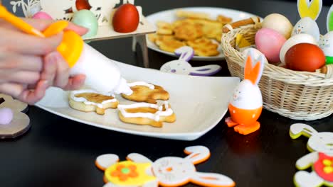 Female-Decorating-Easter-Cookies-in-the-Kitchen