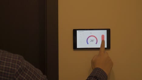 Smart-home-climate-control-device-on-a-wall